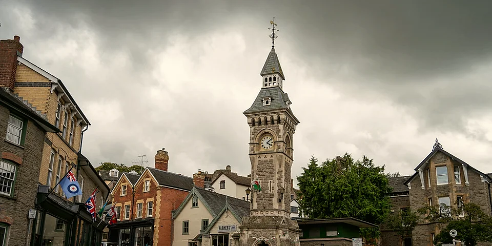 The clock tower above the shopfronts on the square in Hay-on-Wye