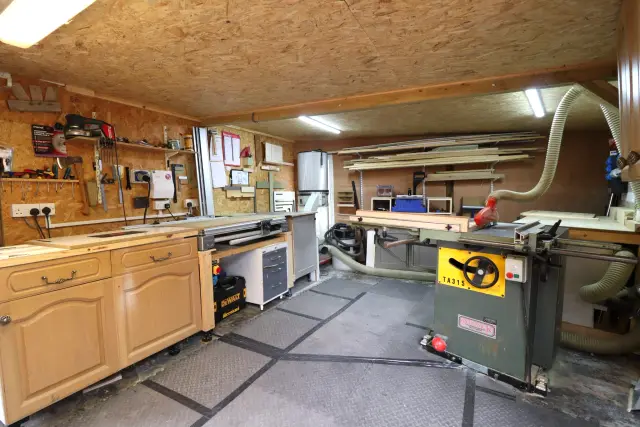 Inside Will's Talgarth workshop: the bench, the timber rack and the saw everything is made on